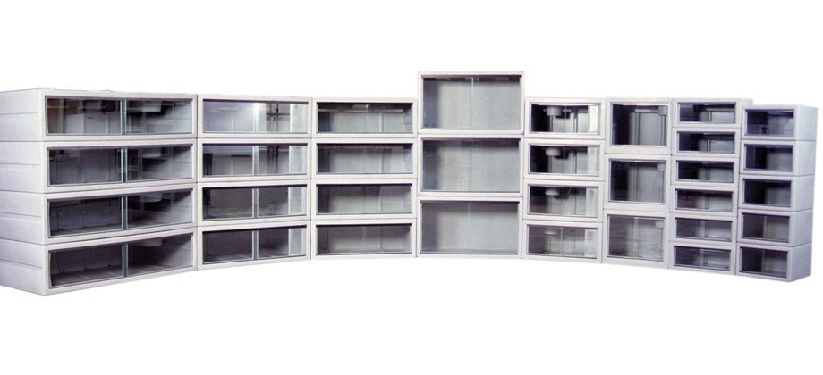 stacked large and small empty reptile enclosures