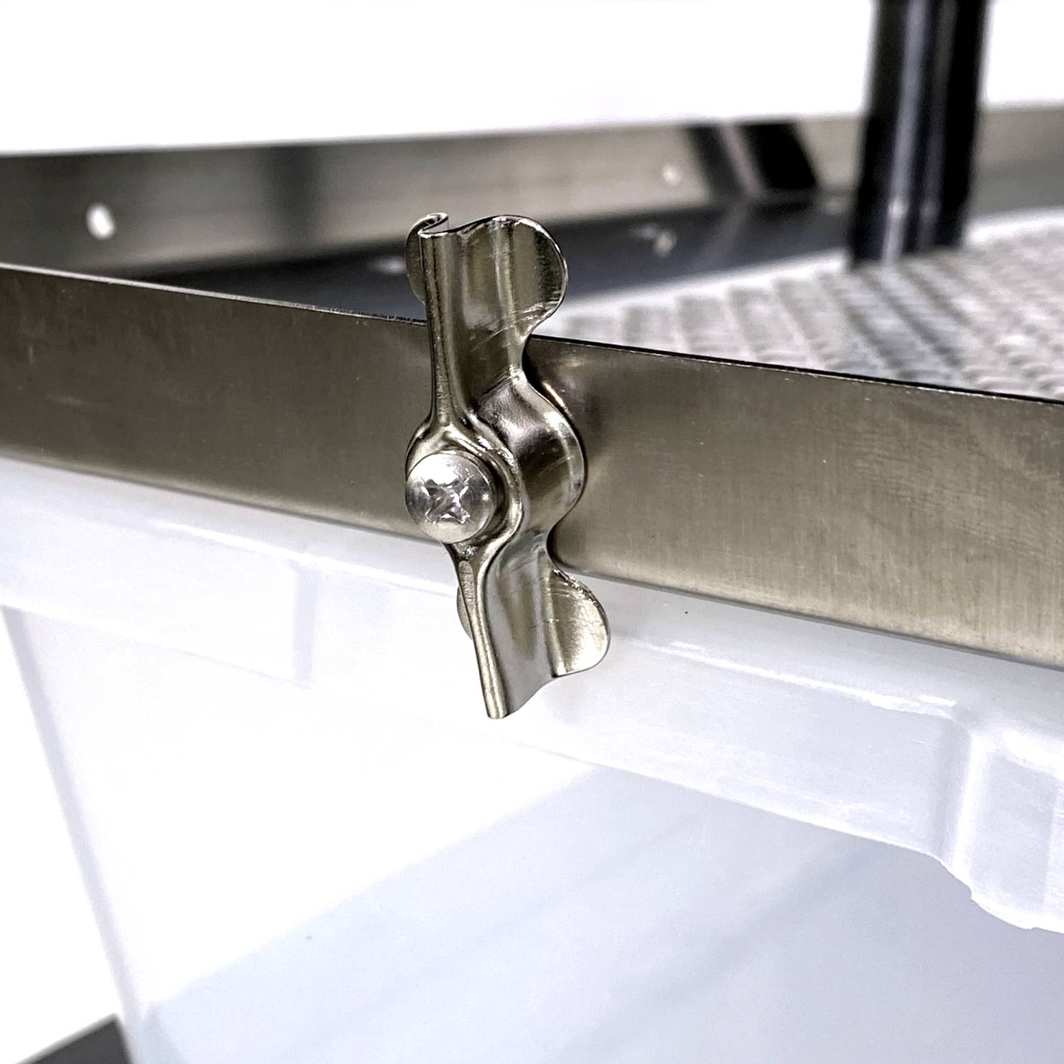 Vision Products rodent rack tub security clip on a rack close up